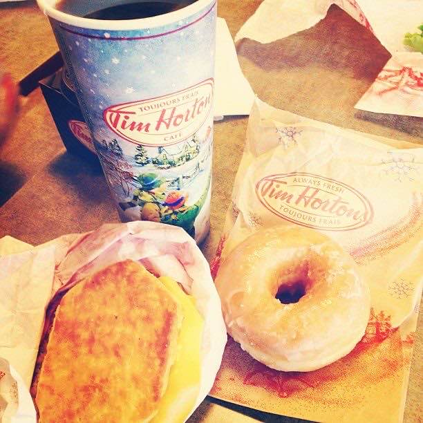 A glazed doughnut and coffee at Tim Hortons