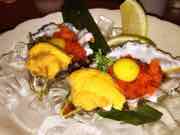 Honeymoon special oyster topped off with uni, roe and quail egg yolk — Shino Sushi photograph by Roger Ma