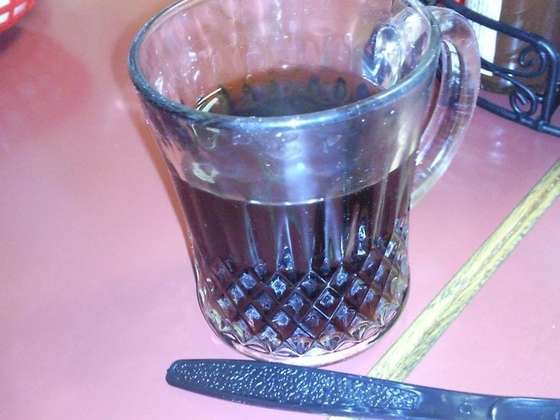 They give out this free strongly brewed Iraqi tea — Sultan Shawarma photograph by Roger Ma